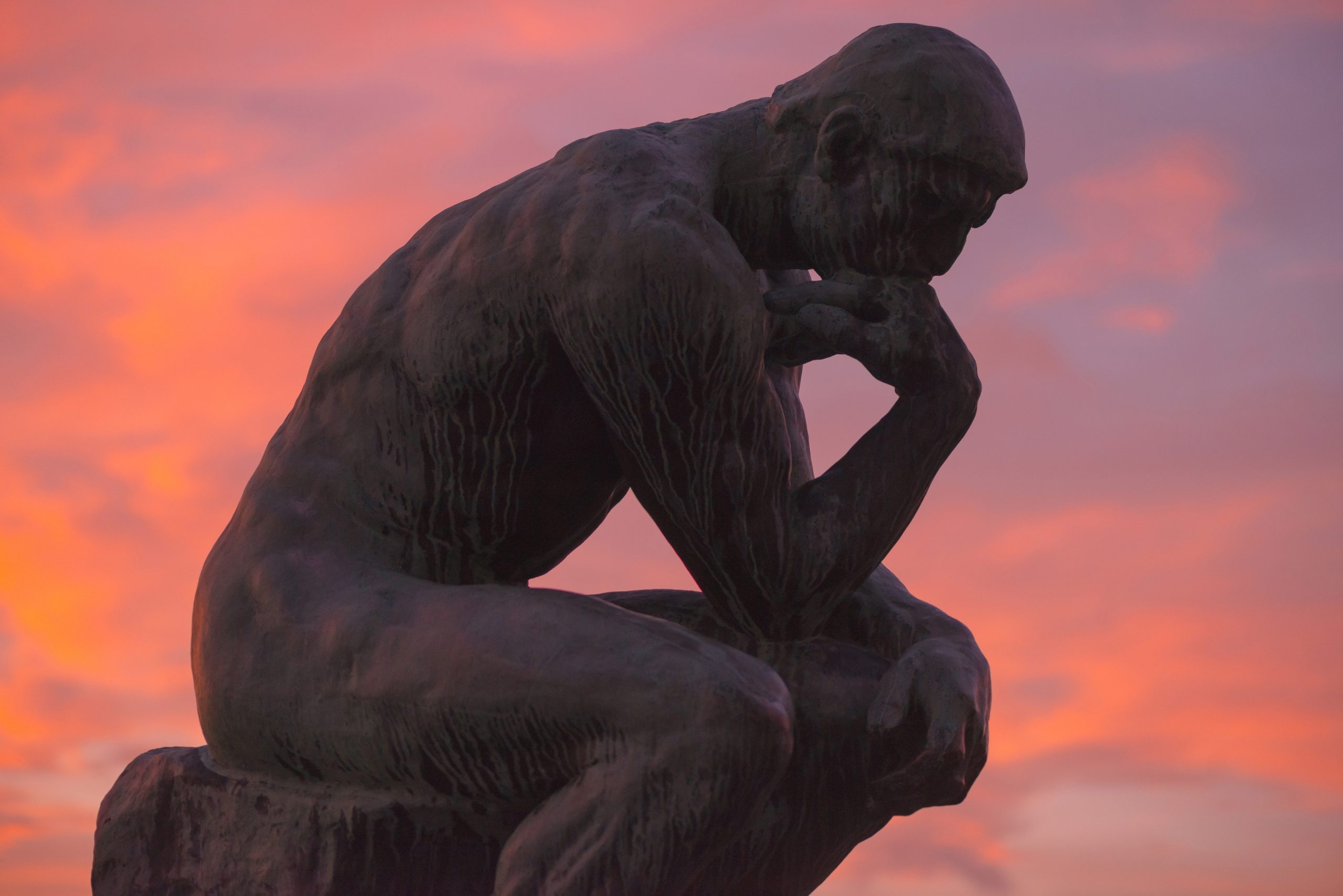 STOCKHOLM, SWEDEN - DEC 30, 2016: Sculpture of the thinker of Rodin at Waldermarsudde in sunset light.